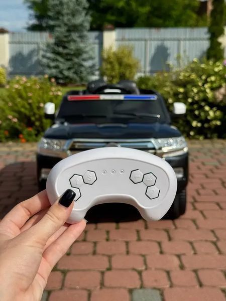Дитячий електромобіль Поліцейський позашляховик (MP3, USB, гойдання, музика, пульт, відкривання дверцят, LED-світло) Чорний G540 G540 фото